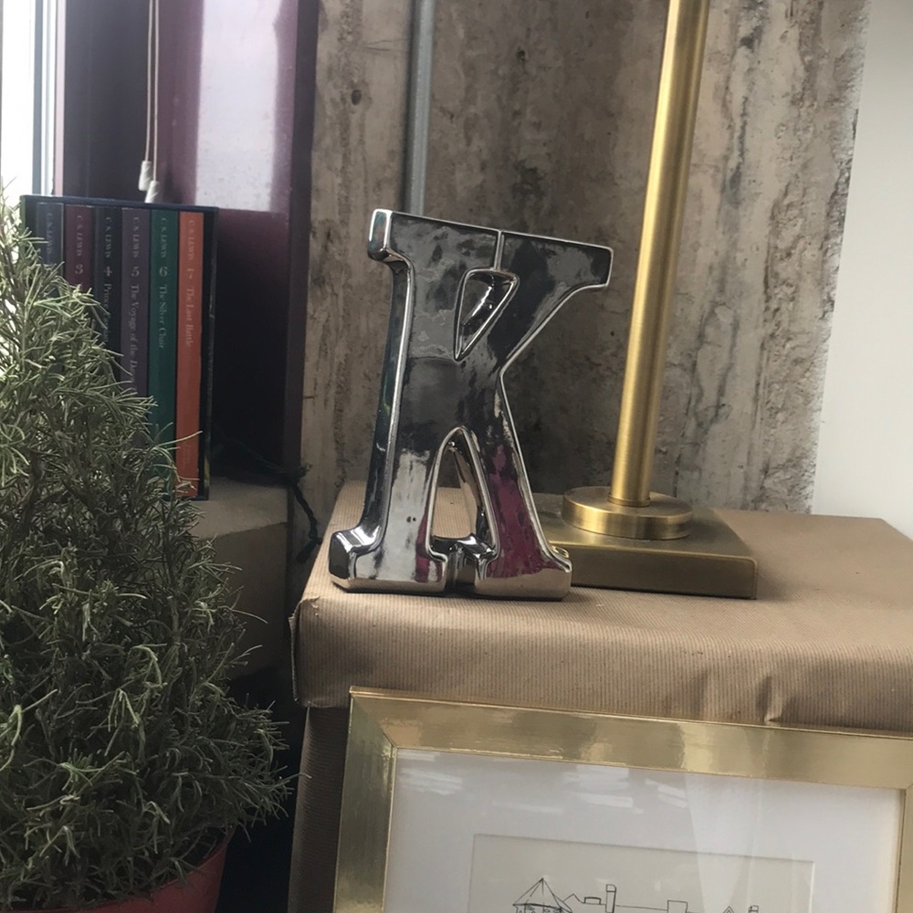 Silver letter K decor DONATING MARCH 1